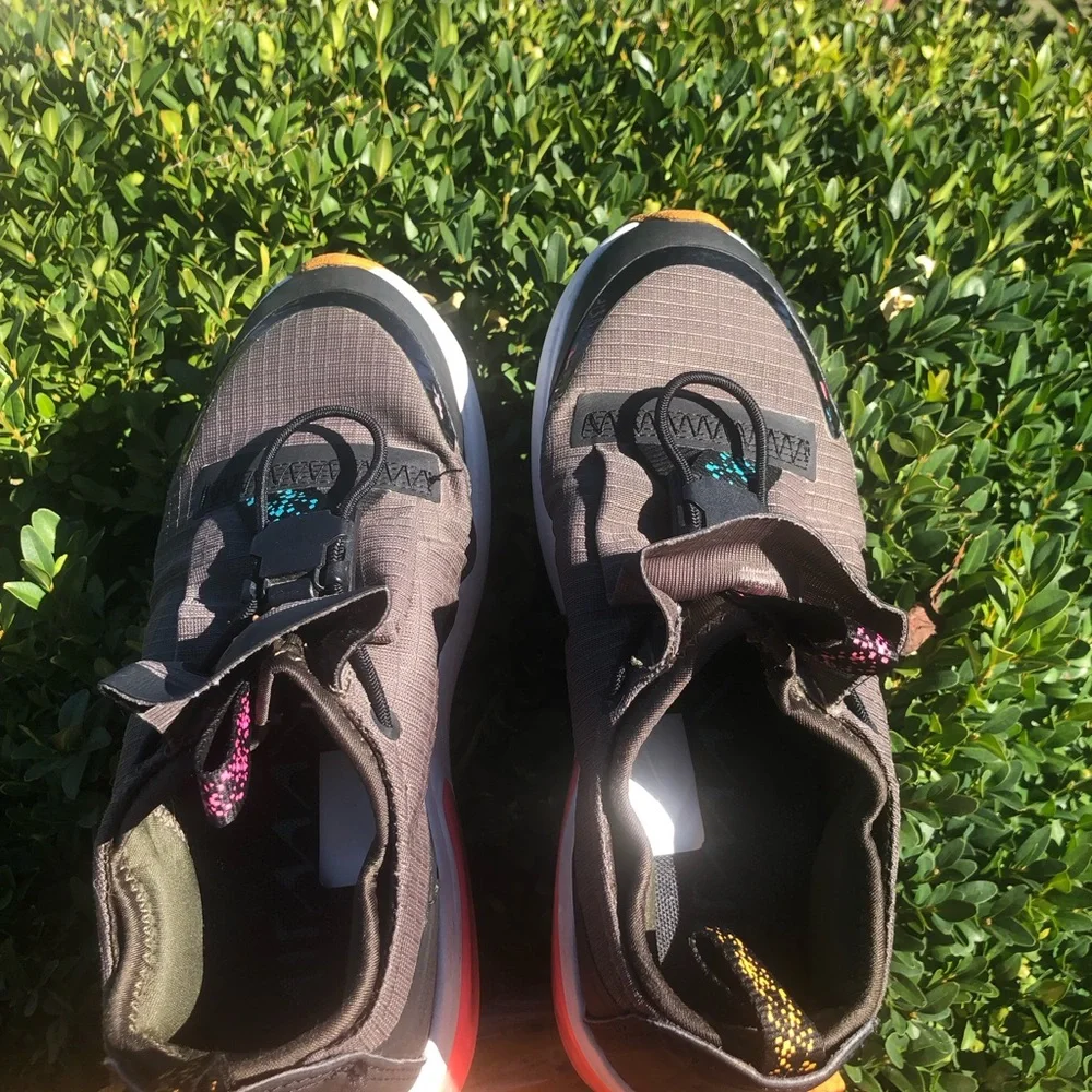 Nike Kids Gray Slip-On Sneakers with Pink Heel Accent
